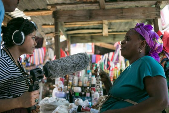 Beenish interviewing a woman in Haiti