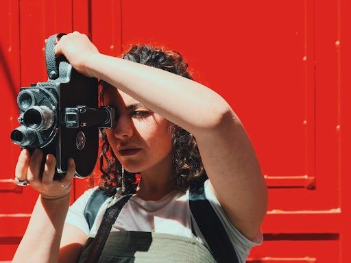 Anna Brotman-Krass holding a camera