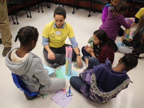 Beatriz Otero Jimenez helps guide the girls through an activity during the FEMMES Fall Capstone.