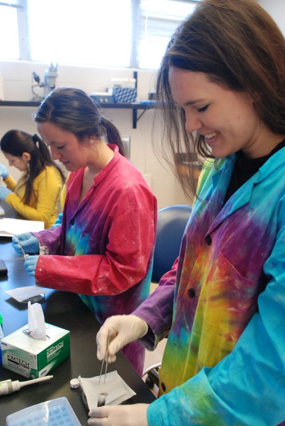 Victoria Zakrzewski (front) and Natalie Greenhalgh work in the lab. 