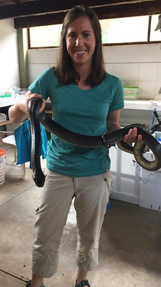 Joanna Larson holds a snake.