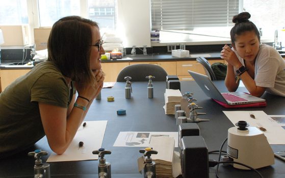 EEB graduate student instructor Lisa Walsh, who designed the new lab with Cindee Giffen, lecturer, discusses an experiment with students, including Jenna Lee.