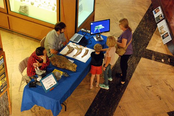ID Day visitors visit the vertebrate fossils exhibit and explore 3-D imaging.