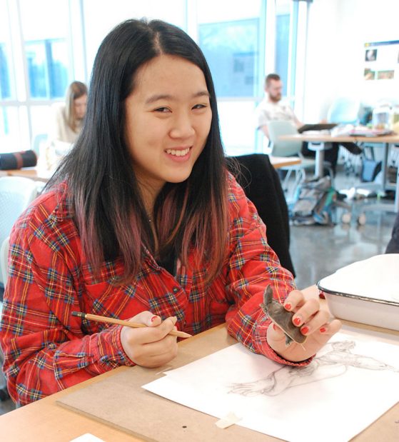 Angela Yee, an EEB major, sketches the spiny softshell turtle