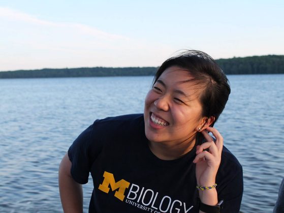Jessica Yan on a boat trip on Douglas Lake at the U-M Biological Station to learn about the ecology of the area.
