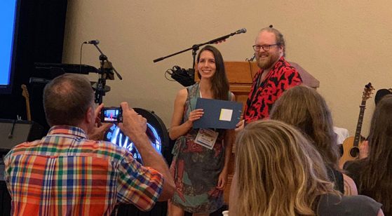 Nate Fuller, a member of the Board of Directors of the North American Society for Bat Research, presents the Luis F. Bacardi Bat Conservation Award to Giorgia Auteri in Puerto Vallarta, Mexico.