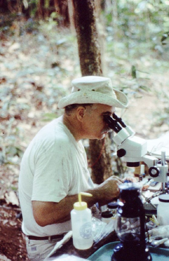 Barry OConnor inTanzania looking through a microscope (1995).