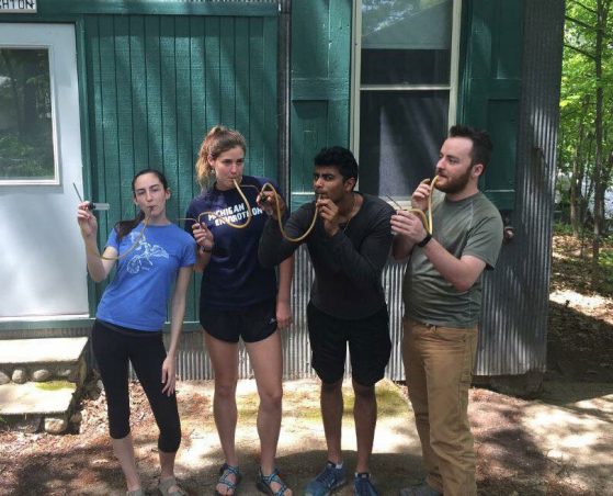 McKenna Turrill with her research group at the U-M Biological Station having some fun with aspirators (used to catch insects). Left to right: Franny Melampy, McKenna Turrill, Kiran Goyal and Reid Osborn. 