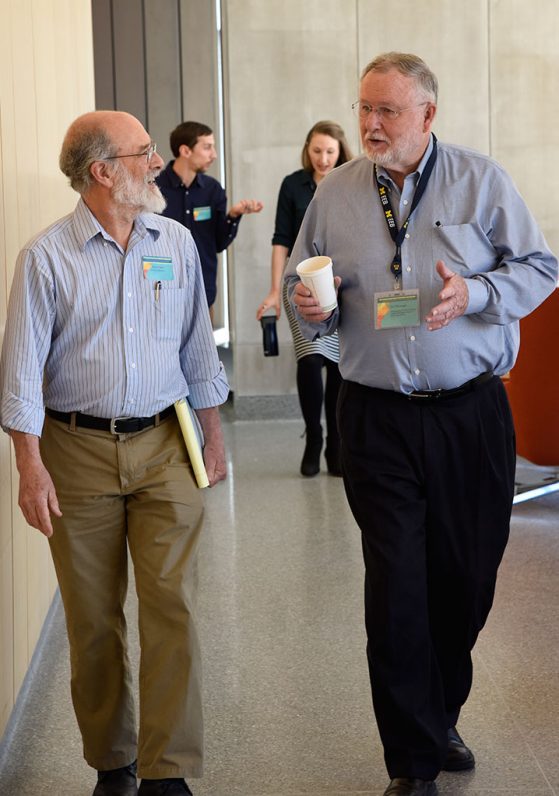 Dan Fisher and Jim Ehleringer discuss research questions, walking together.