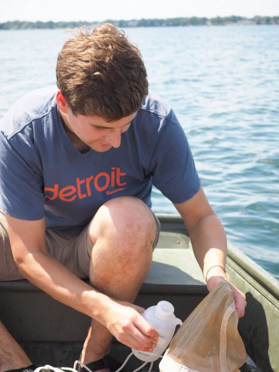 Camden Gowler collecting live Daphnia and other zooplankton from Whitmore Lake.