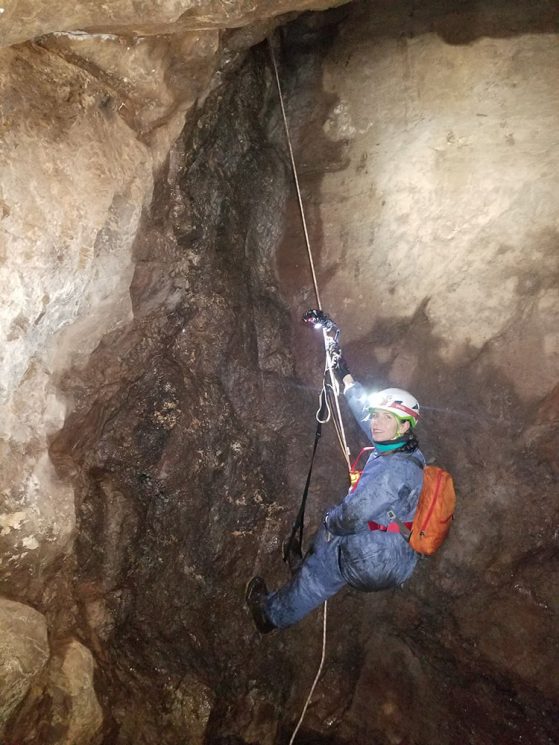 U-M doctoral student Giorgia Auteri rappelling into an abandoned Upper Peninsula copper mine  to study hibernating little brown bats, one of species known to be affected by white-nose syndrome. 