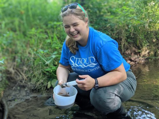 Teresa Sauer collecting streambed sediment in White Clay Creek at the Stroud Water Research Center, Avondale, Penn.
