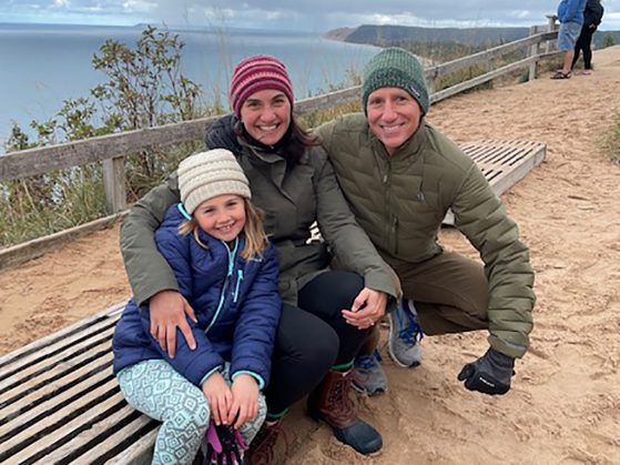 Jennifer Wolff with her family along a coastline