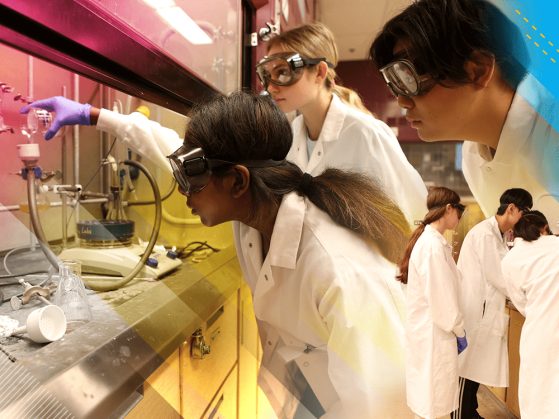 High school students Sadhana Rajesh, Katherine Preheim, and Jake Chon wear white coats and safety goggles while analyzing microplastic samples in a lab.