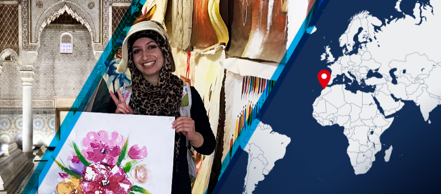 A divided image. On the left, Fatima Haidar holds a painting of pink flowers with her left hand and makes a peace sign with her right hand. On the right half is a map with a red dot in Morocco, indicating where Haidar worked as an intern.