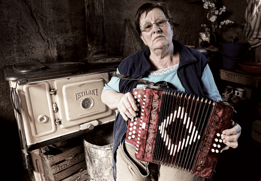 A member of the Afrikaans-speaking community holding an accordion. 