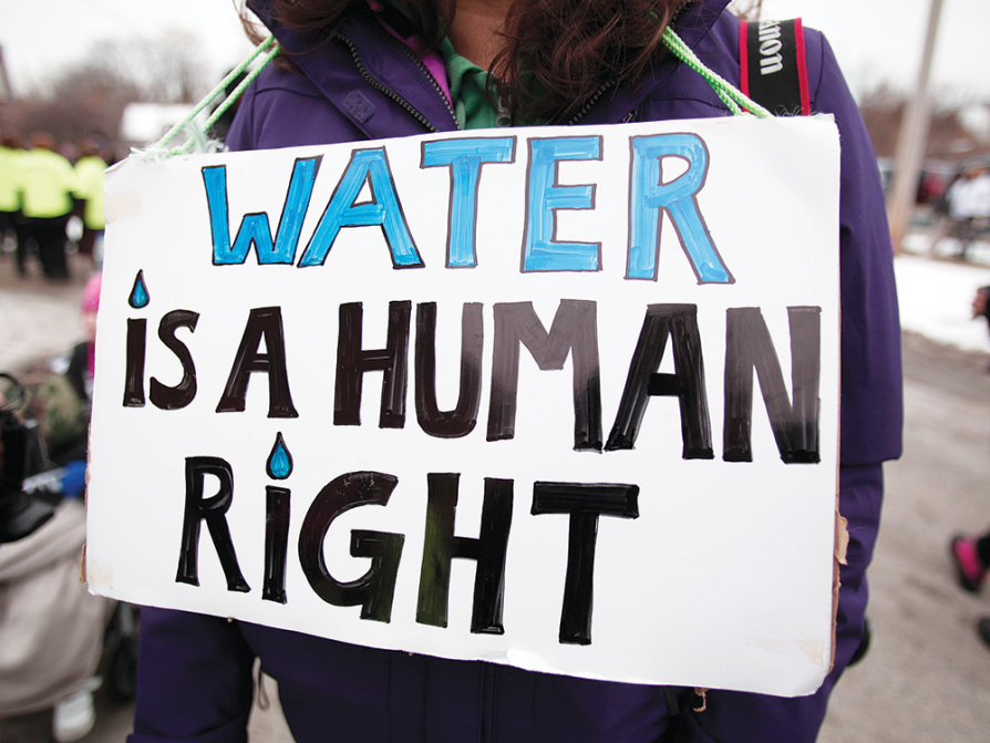 A handmade sign that reads "Water Is a Human Right"