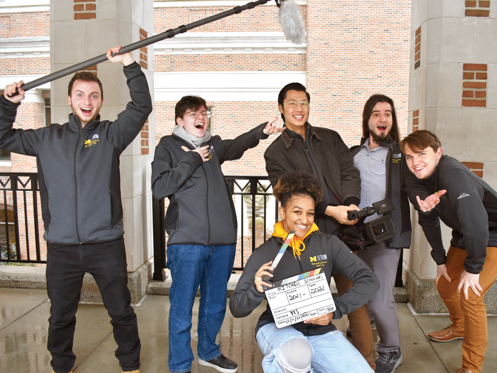 Six current Mitchell Scholars pose outside with big smiles on their faces.