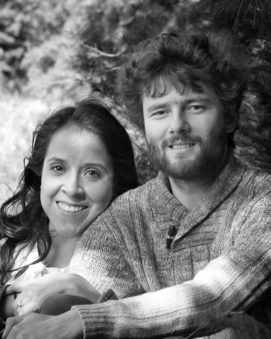 Miriam Llamas and Cody Ladd smile in a black and white photo