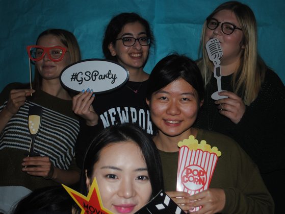 GSP students show off their photo booth props at GSParty