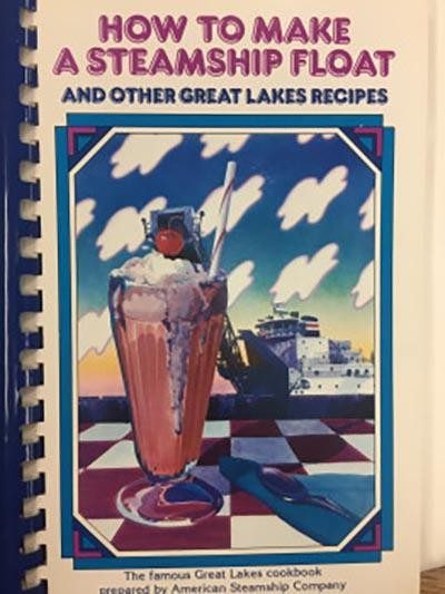 Image of an old cookbook with a strawberry sundae on the cover