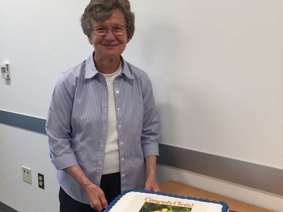 Christiane Anderson cutting her retirement cake