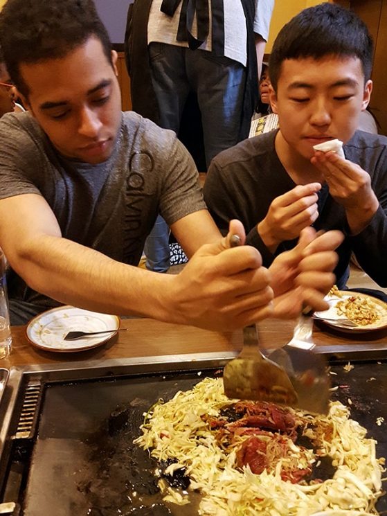 Two History 392 students enjoying okonomiyaki on Tsukishima  