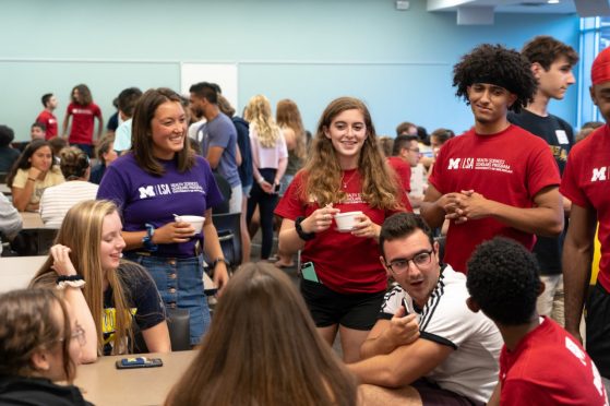 HSSP Student leaders socializing with first-year students at the Welcome Week social
