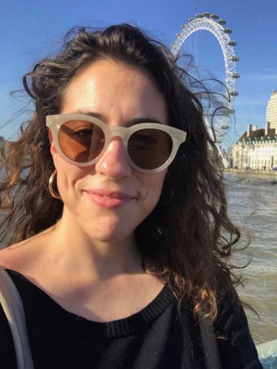 Image of Laura with sunglasses on with the London Eye behind her