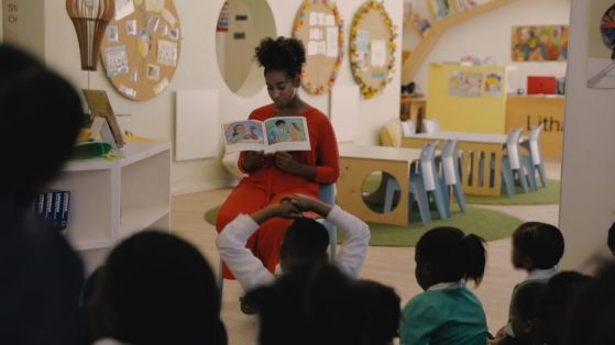 Adelia Davis reads to a group of children
