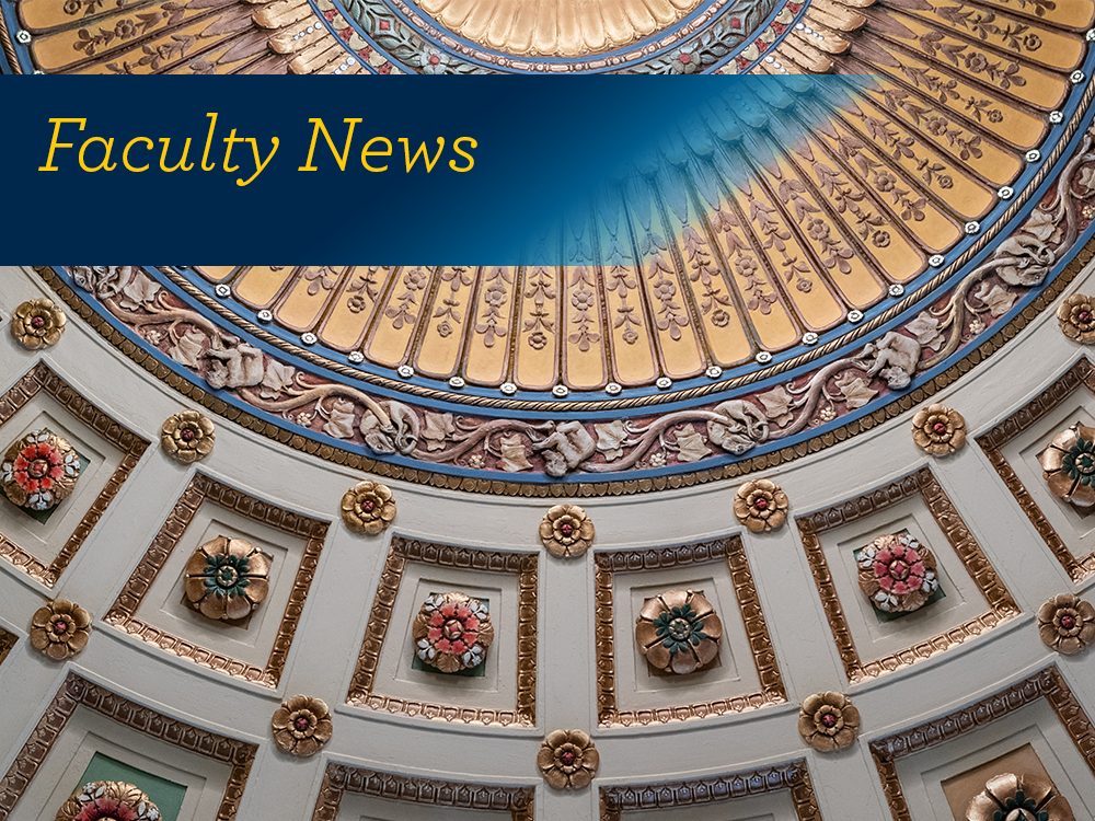 A decorative dome ceiling with the text, "Faculty News"