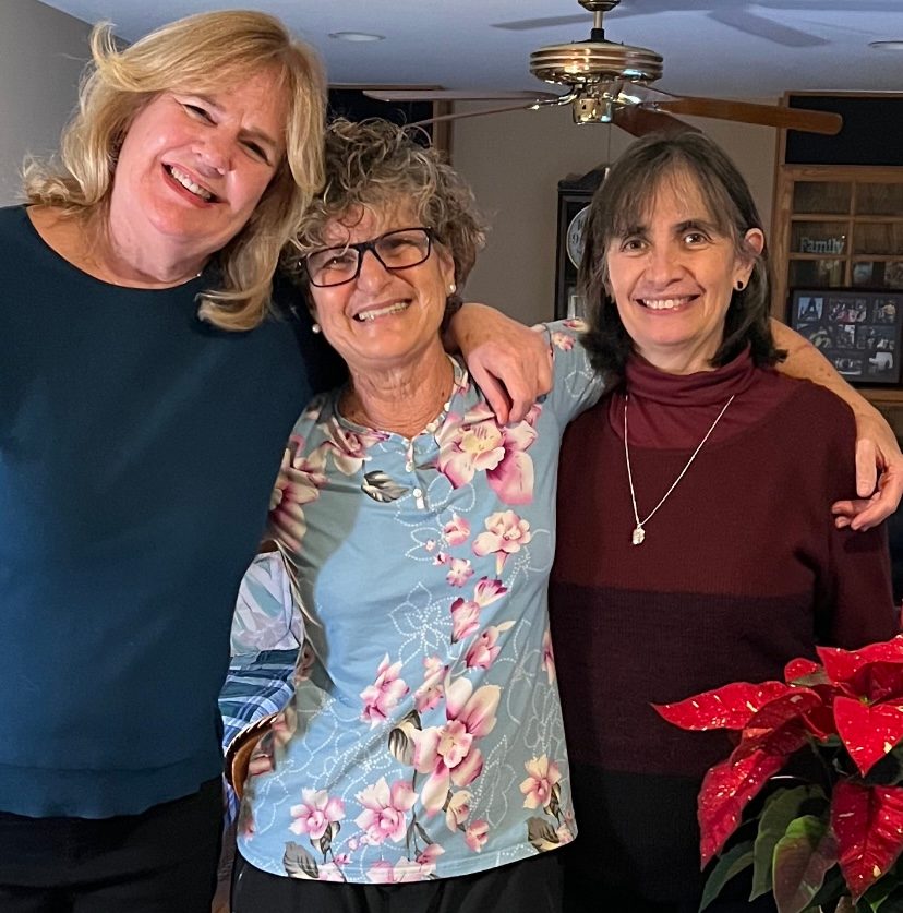 Olga Gallego-Smith smiles with colleagues Ann Hilberry and Maria Dorantes