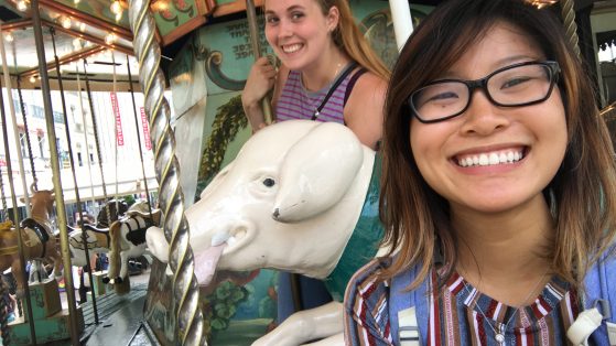 Photo of Hannah Ma and Brenna Potter on carousel.