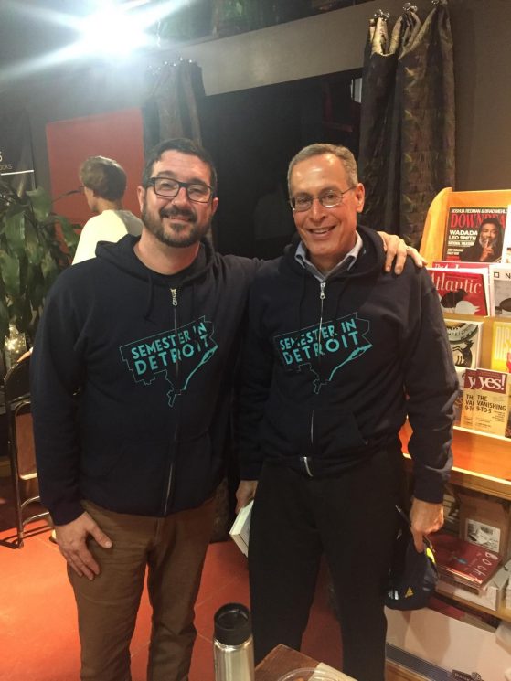 image of two white men wearing semester in detroit sweatshirts