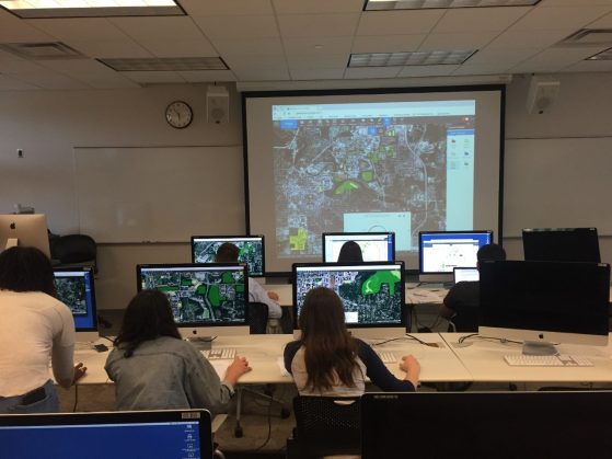 Students in EARTH 380 using GeoPlanner for ArcGIS to apportion solar power arrays across university-owned land and structures to meet a 500GWHr per year production goal.