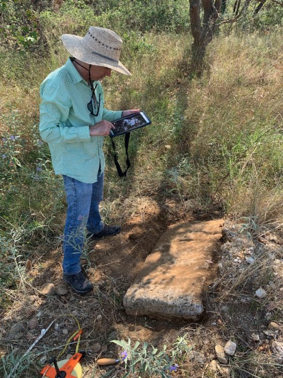 David Stone recording data on an archaeological find using an ArcGIS field app at Olynthos, Greece.