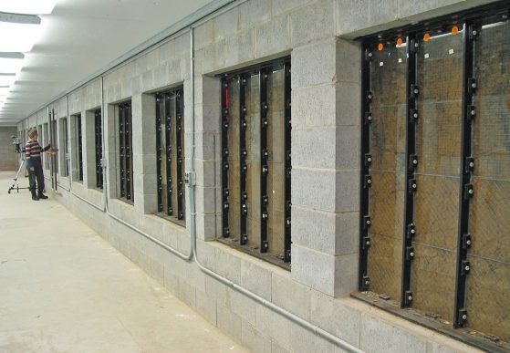 The walls of an underground room are shown, with windows that show the soil outside the walls.