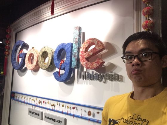 Shao Wei Chia standing in front of a Google Logo